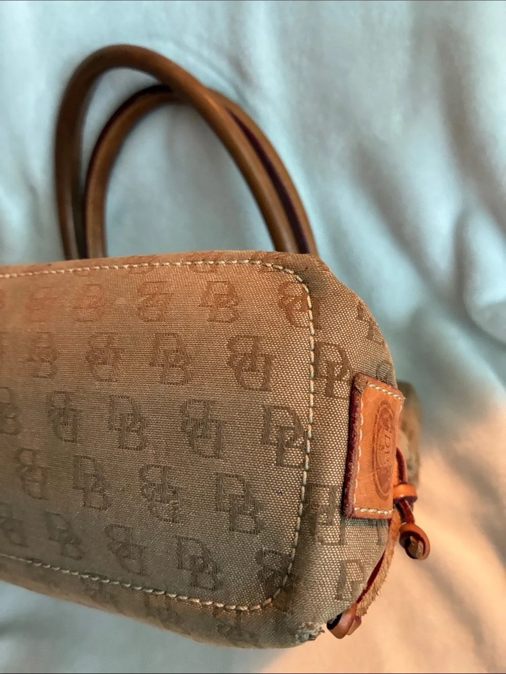 Dooney & Bourke  Brown Monogram Handbag with Tassel Accent